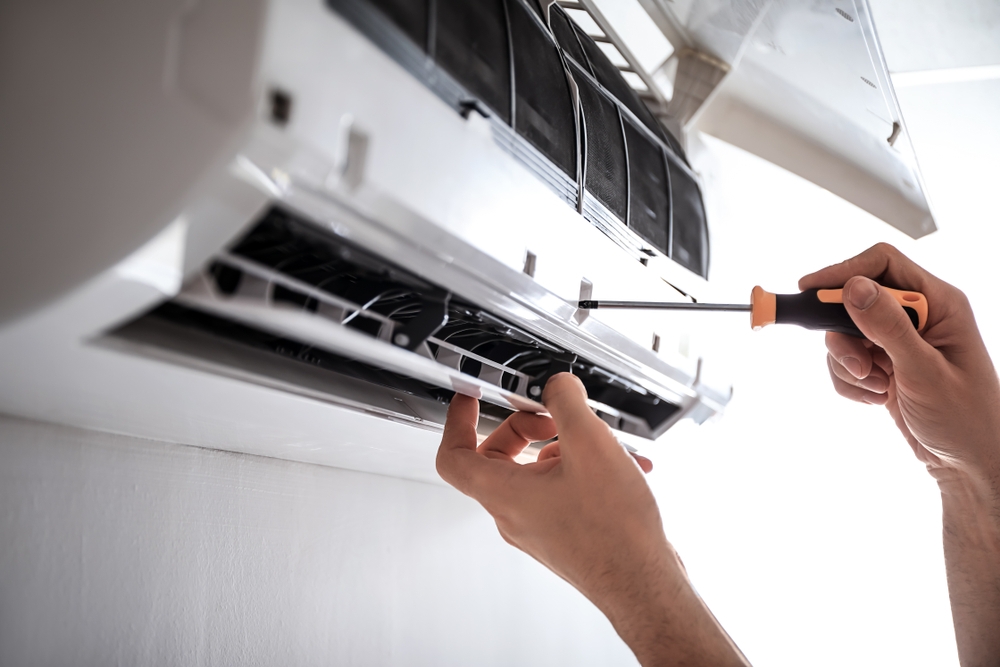 Licensed technician installing a split system